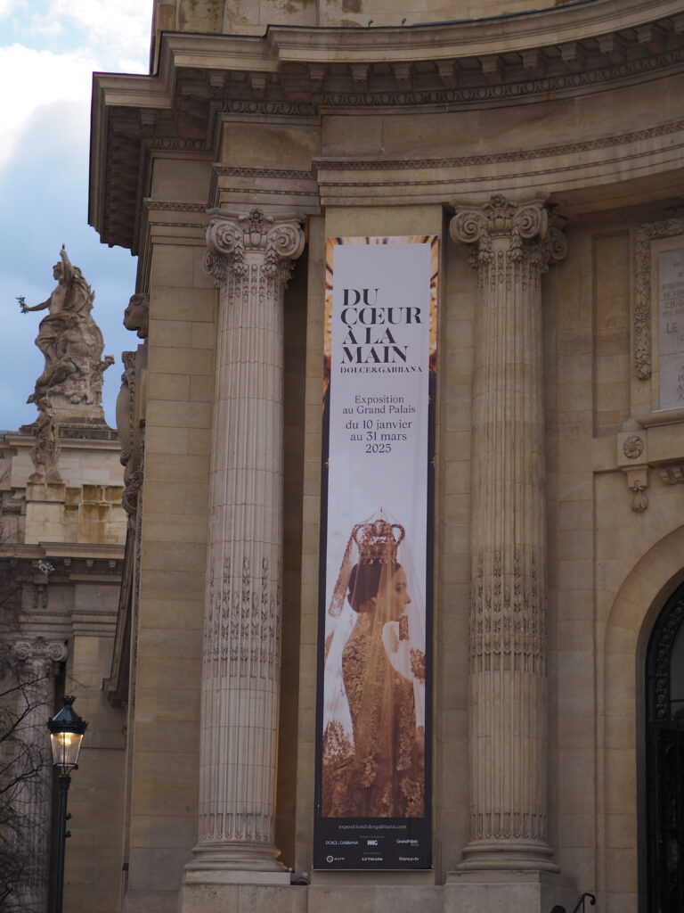 Grand Palais entrance featuring the Du Cœur à la Main Dolce & Gabbana exhibition banner.