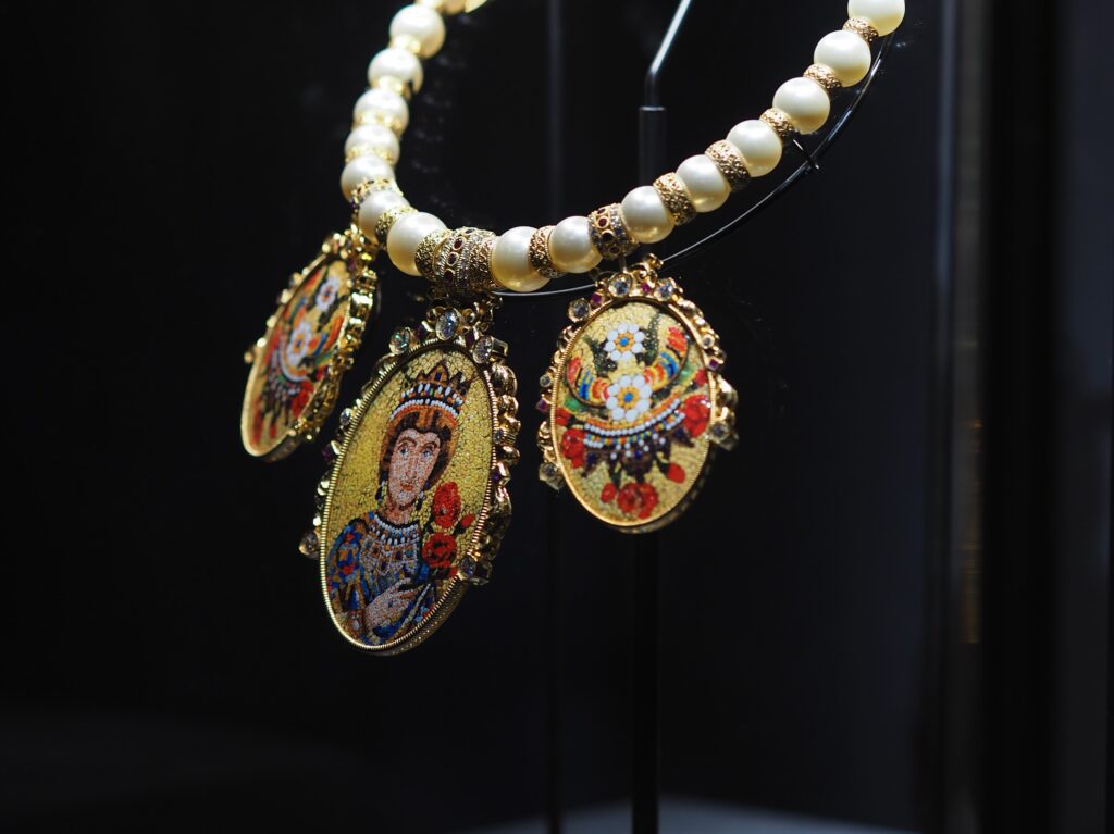 Close-up of a Dolce & Gabbana accessory with elegant gold detailing, part of the Grand Palais exhibition.