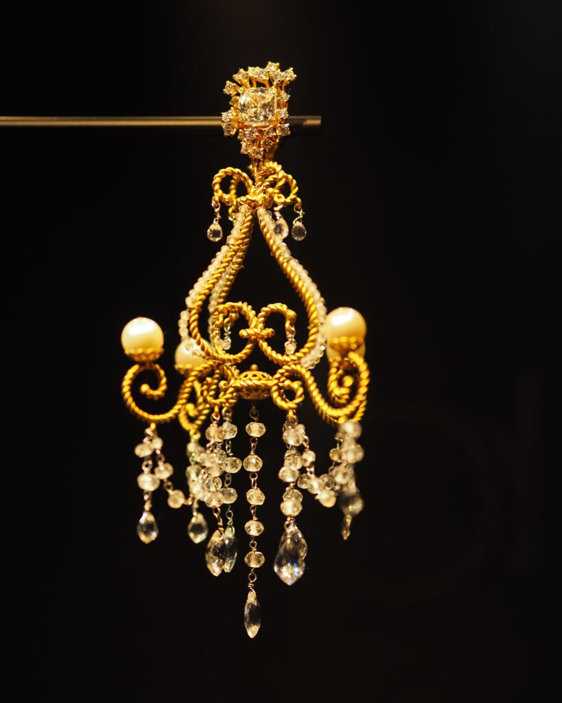 Close-up of a Dolce & Gabbana accessory with elegant gold detailing, part of the Grand Palais exhibition.