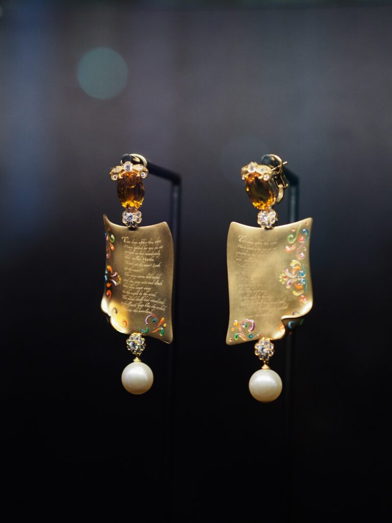 Close-up of a Dolce & Gabbana accessory with elegant gold detailing, part of the Grand Palais exhibition.